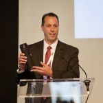 Nick Neri of Mainstream raffles off a fancy water bottle